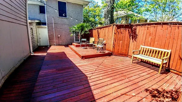 a view of a wooden deck with a patio