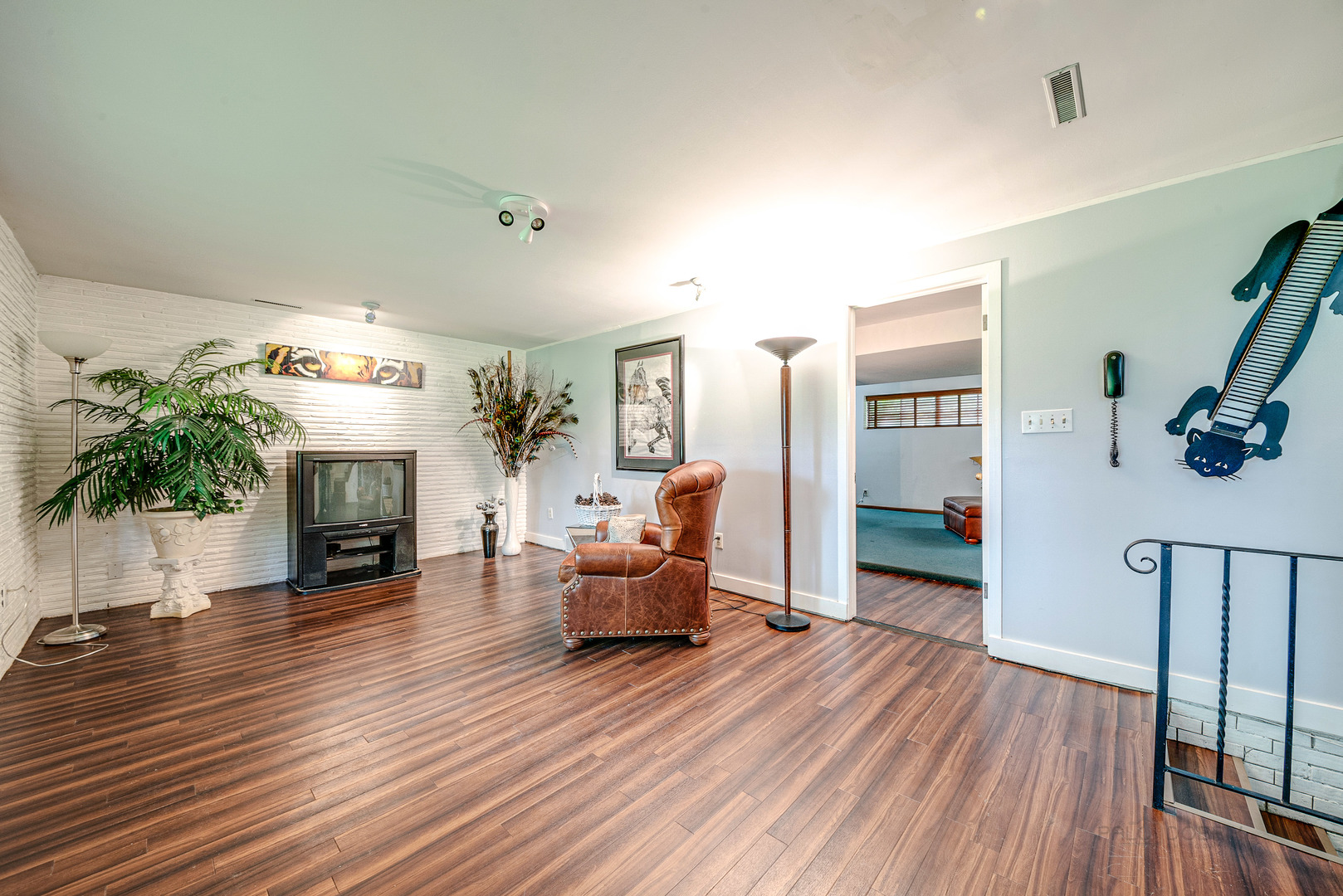703 Hickory Road Woodstock, IL 60098 - Photo 15 of 33 a living room with furniture and a fireplace