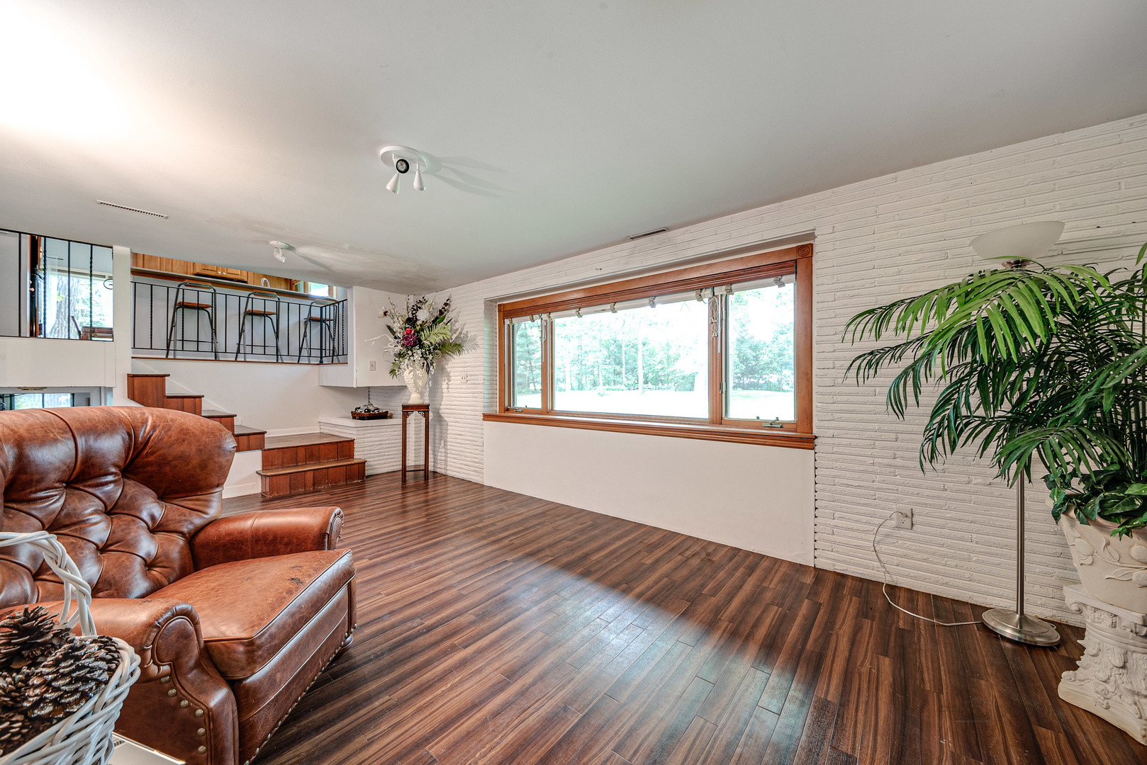703 Hickory Road Woodstock, IL 60098 - Photo 16 of 33 a living room with furniture and a wooden floor