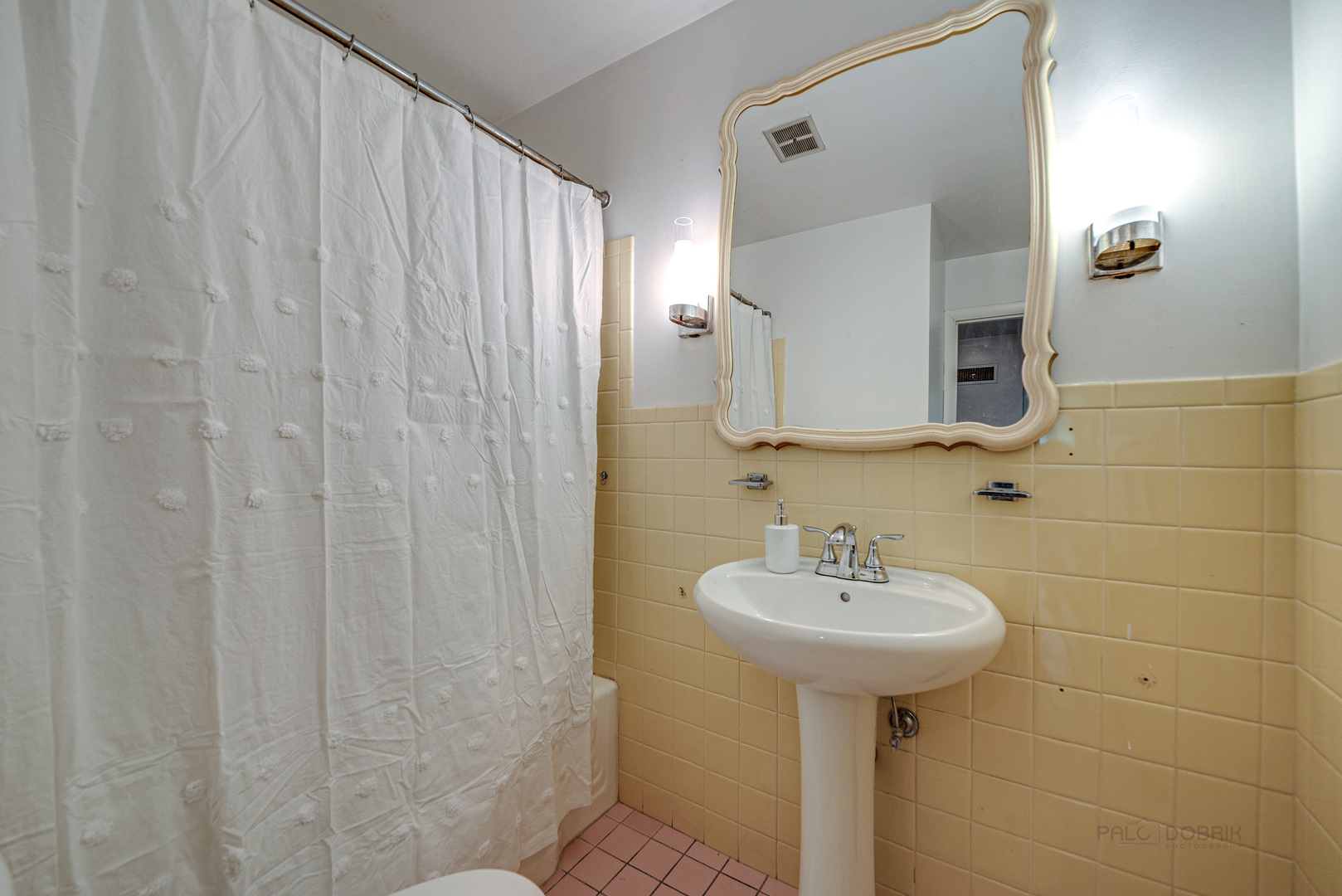 703 Hickory Road Woodstock, IL 60098 - Photo 24 of 33 a bathroom with a sink a mirror and a shower