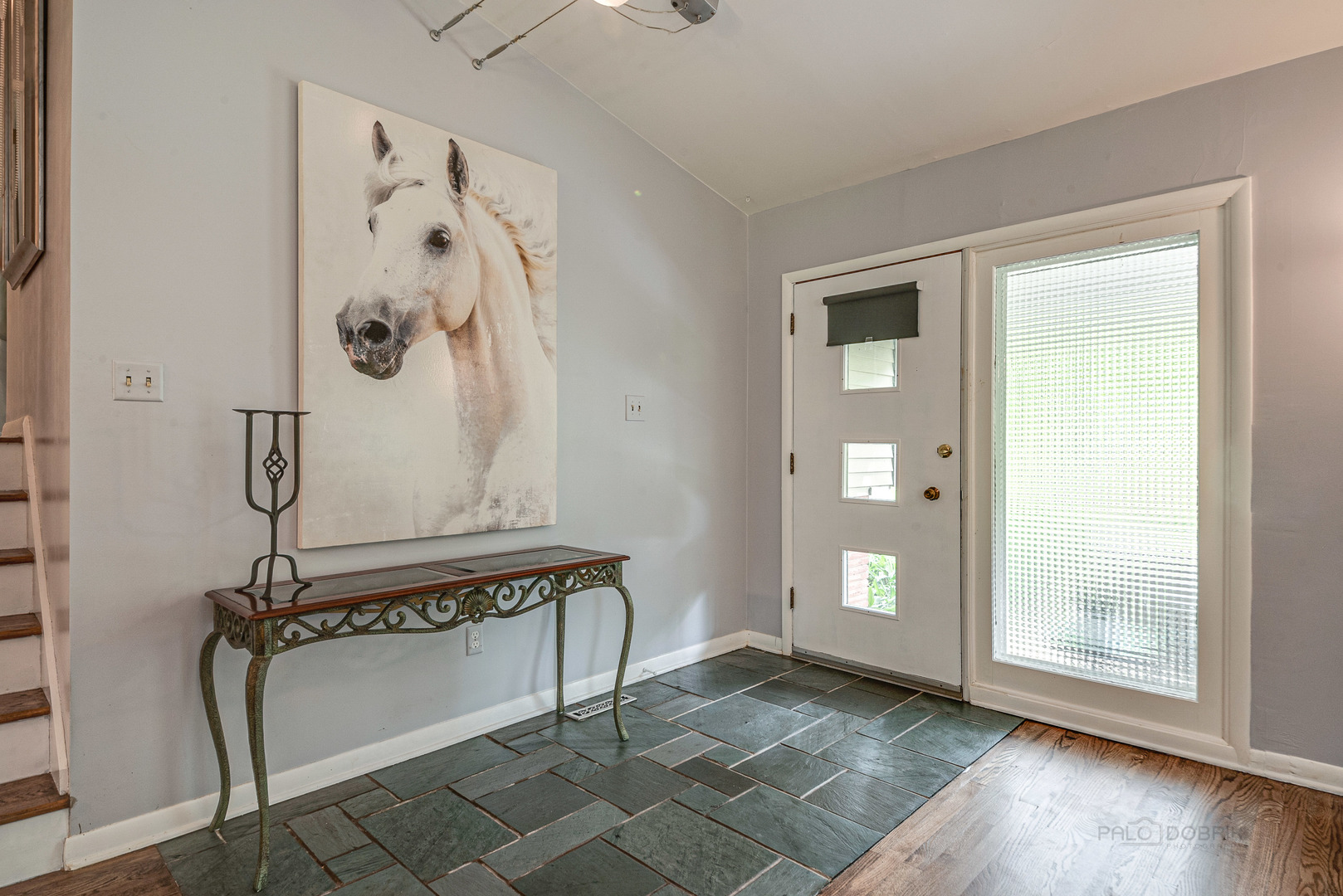703 Hickory Road Woodstock, IL 60098 - Photo 6 of 33 a view of an entryway with wooden floor