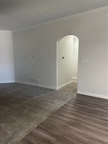 a kitchen with granite countertop a sink and a refrigerator