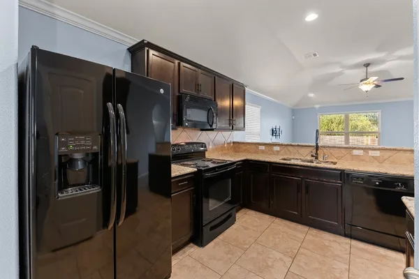 a kitchen with a stove and a microwave