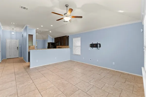 a view of a kitchen with a sink and cabinets