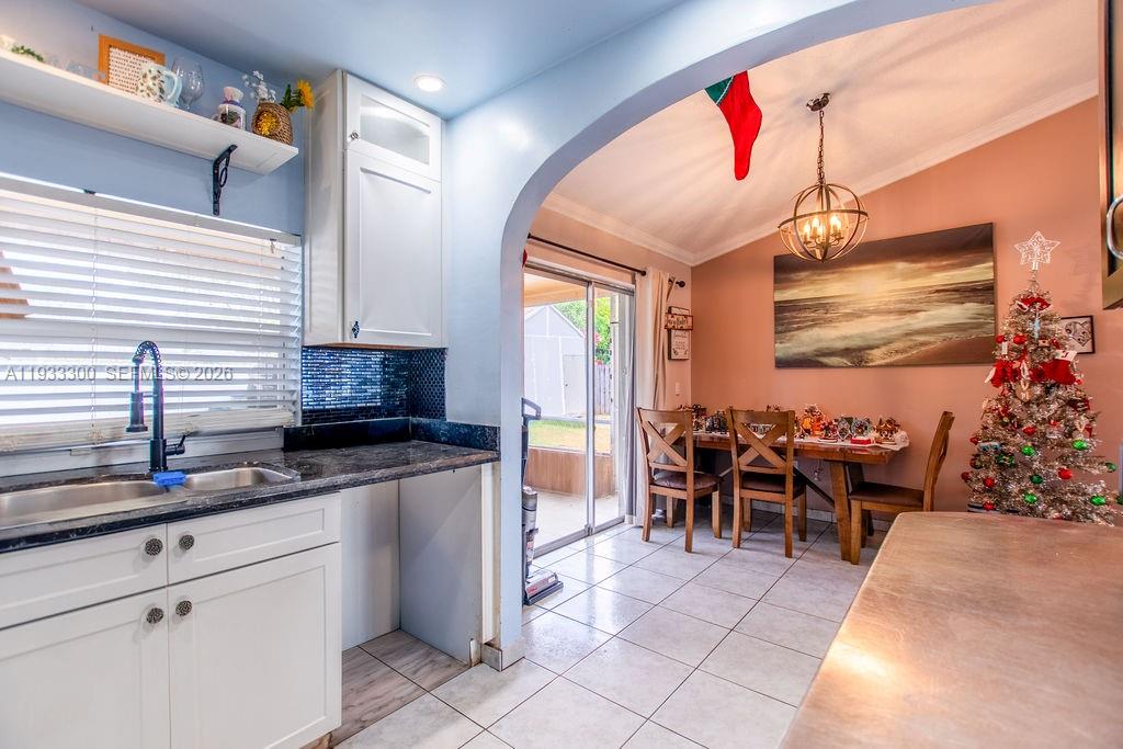 11751 Northwest 32nd Manor Sunrise, FL 33323 - Photo 13 of 32 a group of people sitting in a kitchen