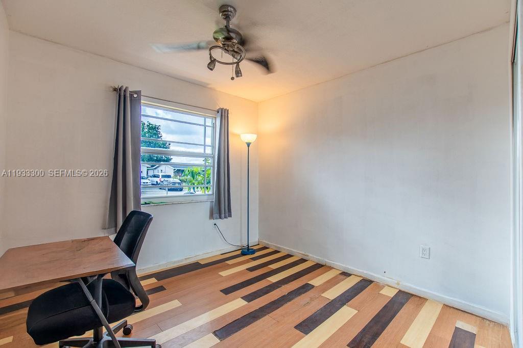 11751 Northwest 32nd Manor Sunrise, FL 33323 - Photo 14 of 32 a view of a workspace with furniture and a window