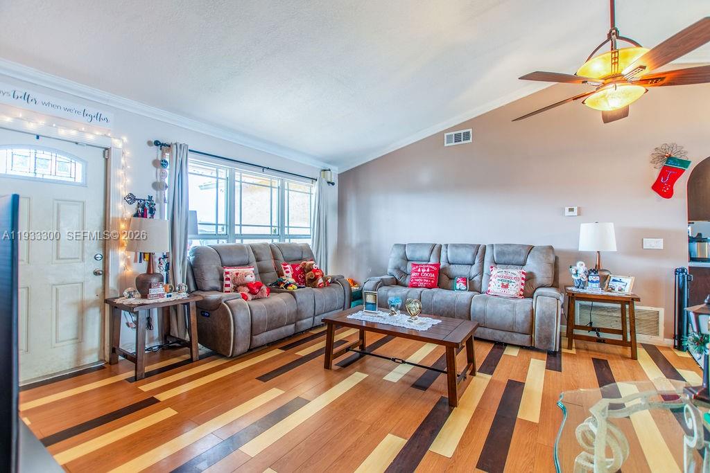 11751 Northwest 32nd Manor Sunrise, FL 33323 - Photo 2 of 32 a living room with furniture and a wooden floor