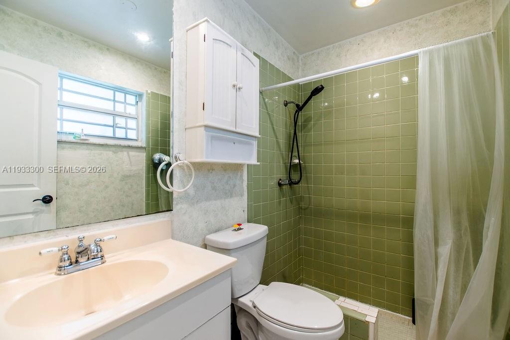11751 Northwest 32nd Manor Sunrise, FL 33323 - Photo 22 of 32 a bathroom with a sink toilet and shower
