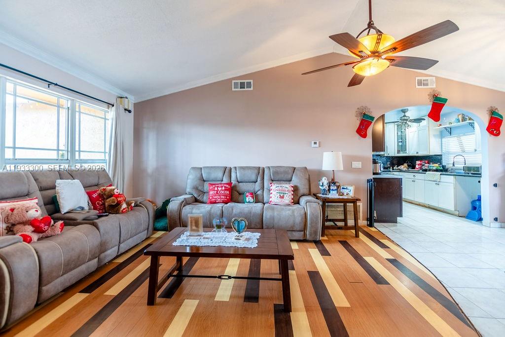 11751 Northwest 32nd Manor Sunrise, FL 33323 - Photo 4 of 32 a living room with furniture and kitchen view