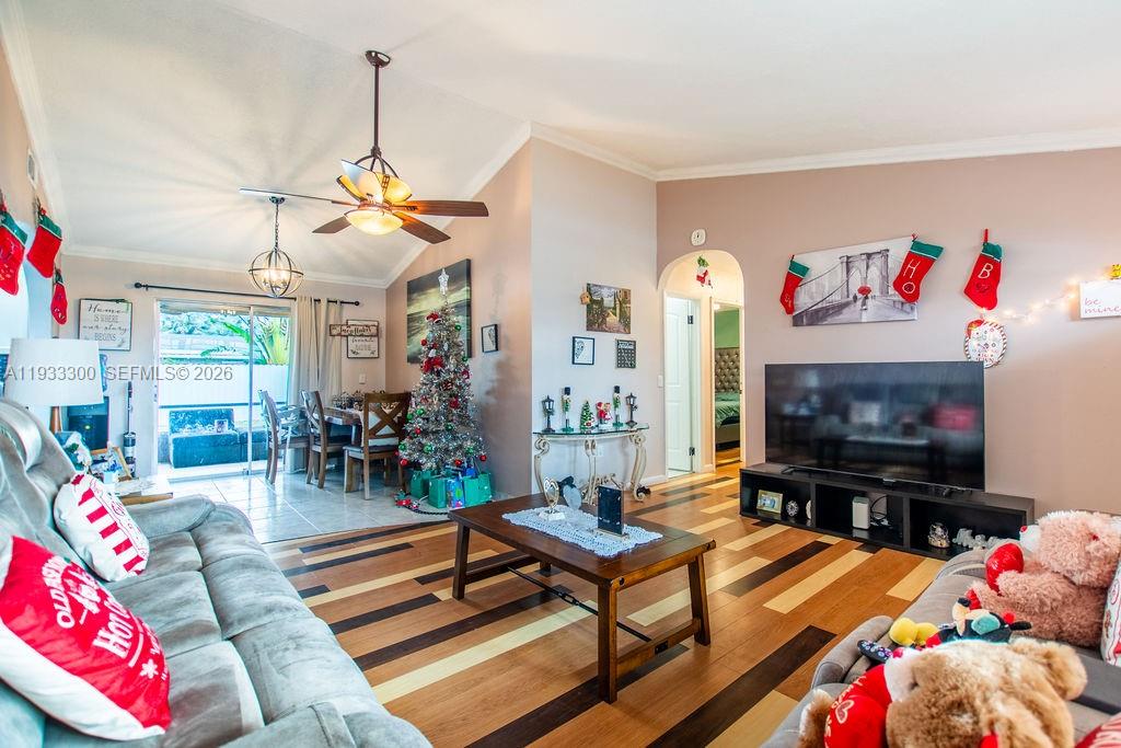 11751 Northwest 32nd Manor Sunrise, FL 33323 - Photo 6 of 32 a living room with furniture and a flat screen tv