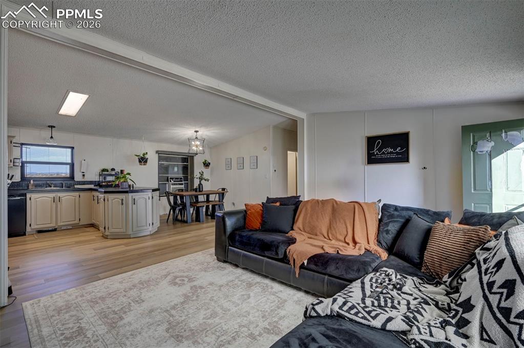 21050 McDaniels Road Calhan, CO 80808 - Photo 13 of 46 a living room with furniture and kitchen view