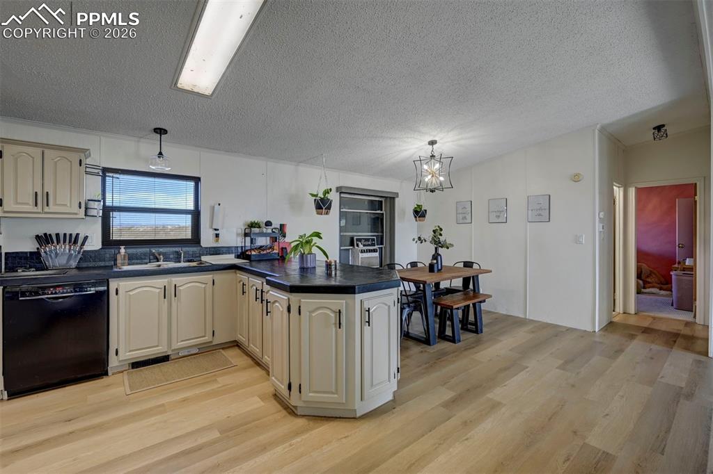 21050 McDaniels Road Calhan, CO 80808 - Photo 16 of 46 a kitchen that has a lot of white cabinets and stainless steel appliances