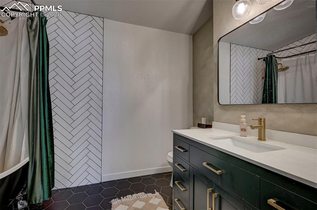 21050 McDaniels Road Calhan, CO 80808 - Photo 23 of 46 a bathroom with a sink and a mirror