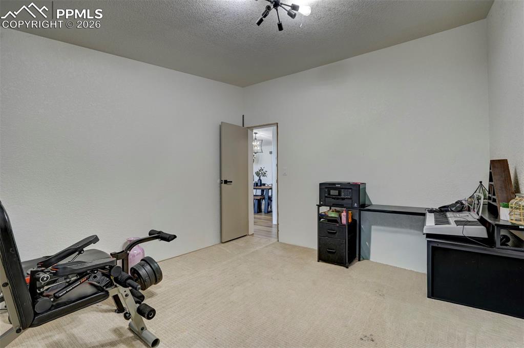 21050 McDaniels Road Calhan, CO 80808 - Photo 27 of 46 a view of a workspace with furniture