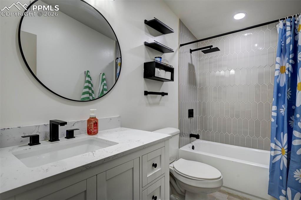 21050 McDaniels Road Calhan, CO 80808 - Photo 28 of 46 a bathroom with a sink a toilet and a mirror