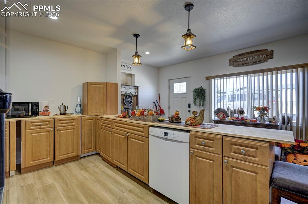 21050 McDaniels Road Calhan, CO 80808 - Photo 36 of 46 a kitchen with sink cabinets and window