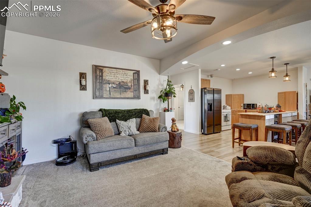 21050 McDaniels Road Calhan, CO 80808 - Photo 42 of 46 a living room with furniture and kitchen view