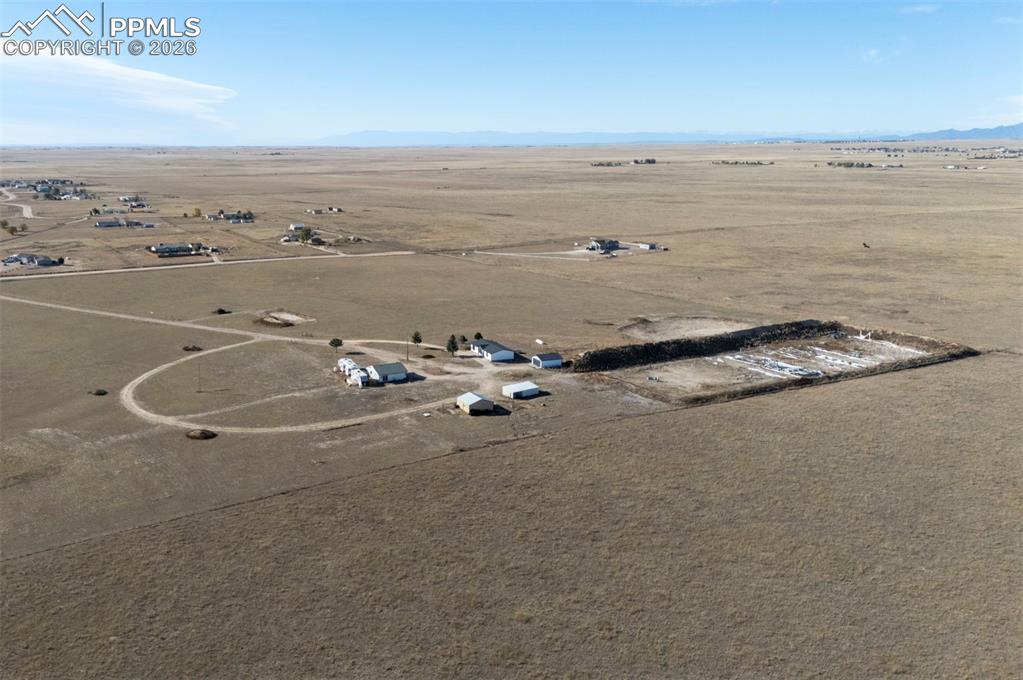 21050 McDaniels Road Calhan, CO 80808 - Photo 7 of 46 an ocean beach with an outdoor seating