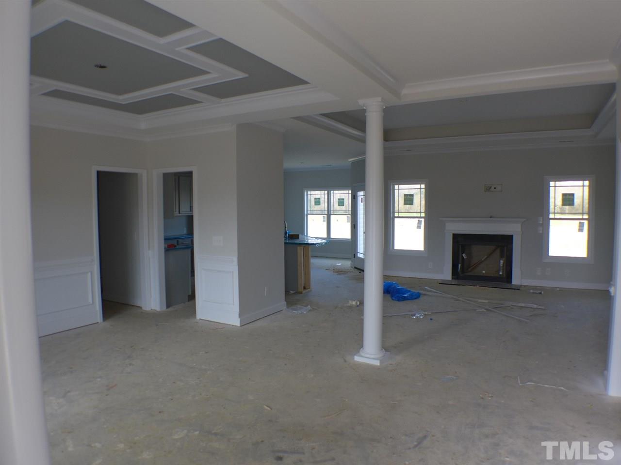 2589 Stanley Hall Road Dunn, NC 28334 - Photo 3 of 13 a view of an empty room with a fireplace