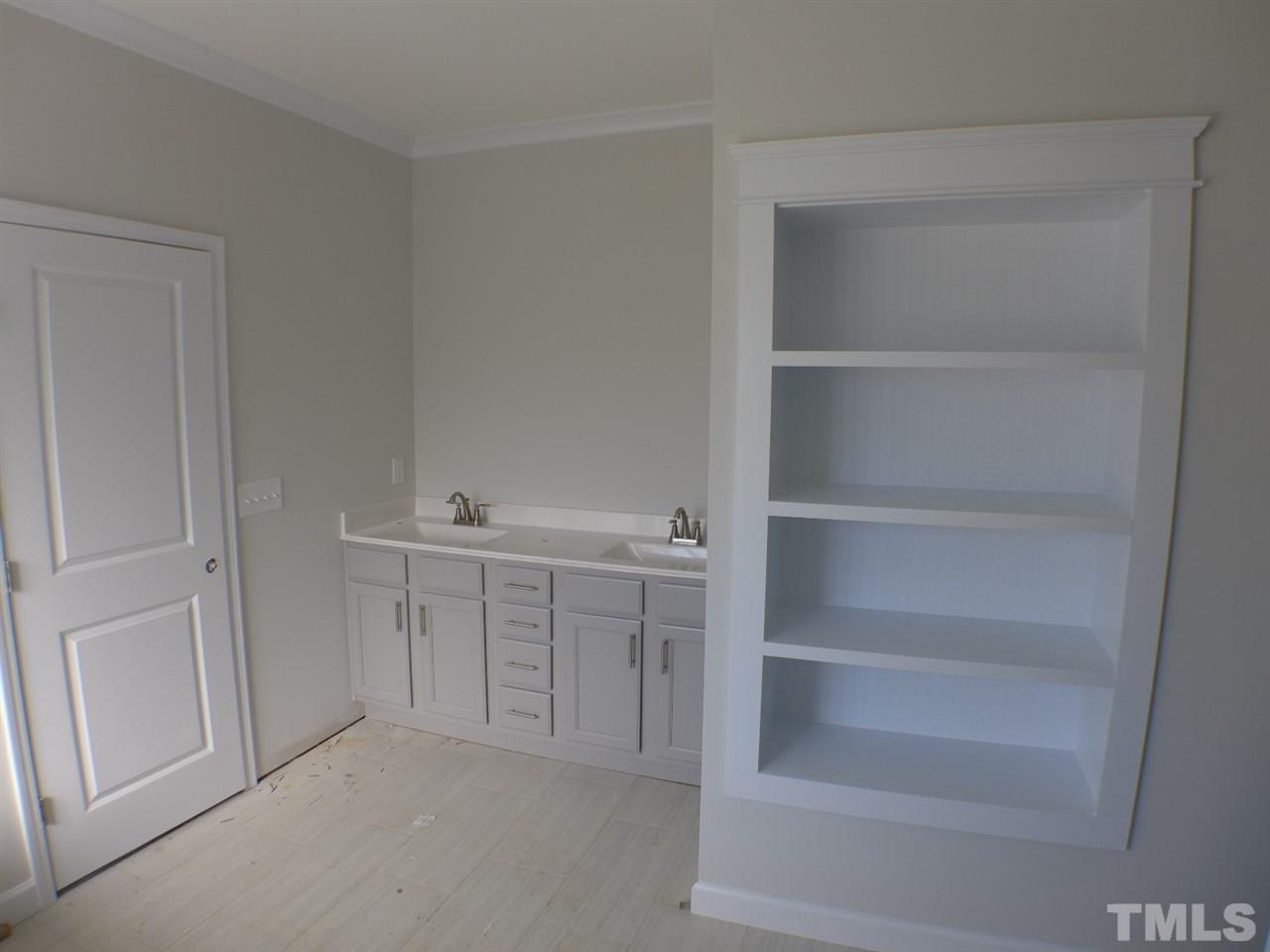 2589 Stanley Hall Road Dunn, NC 28334 - Photo 7 of 13 a view of an empty walk in closet