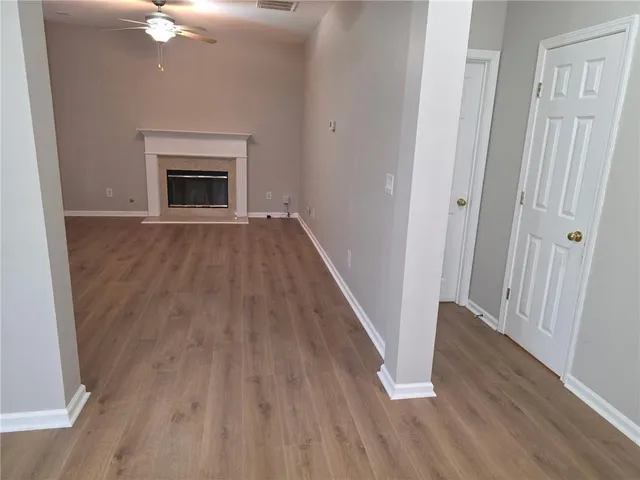 wooden floor fireplace in an empty room