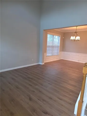 wooden floor and window in an empty room