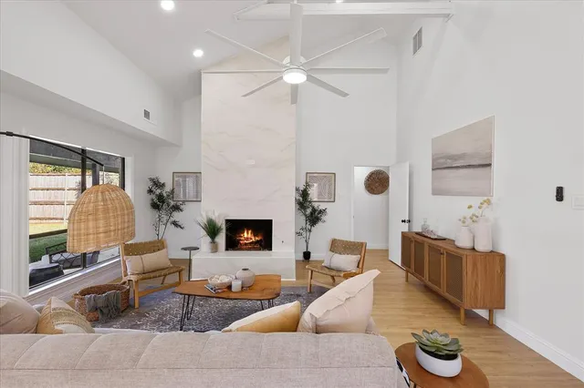a living room with furniture and a fireplace