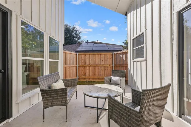 a view of house with backyard and porch