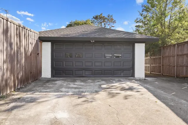 an aerial view of a house with a yard swimming pool and outdoor seating