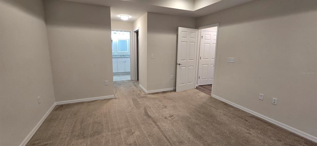 16263 Southwest 48th Circle Ocala, FL 34473 - Photo 14 of 16 wooden floor and glass door in a room
