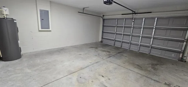a view of an empty room with a white walls