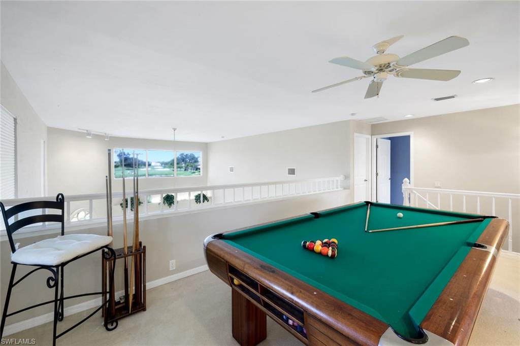 11822 Quail Village Way Naples, FL 34119 - Photo 17 of 34 a room with pool table and windows