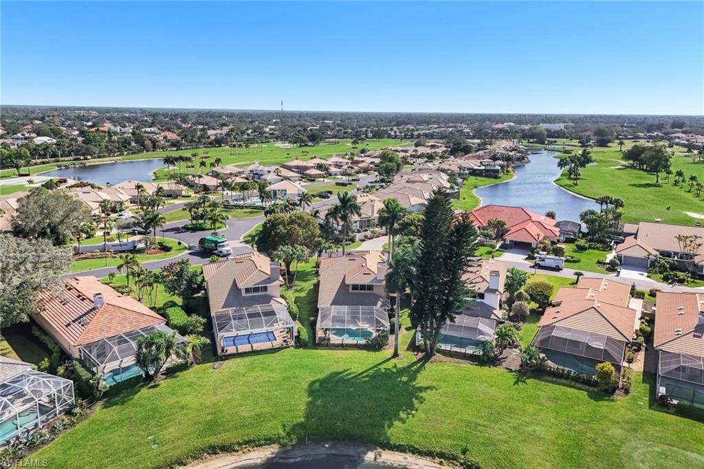 11822 Quail Village Way Naples, FL 34119 - Photo 24 of 34 an aerial view of multiple house
