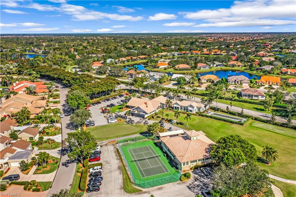 11822 Quail Village Way Naples, FL 34119 - Photo 28 of 34 an aerial view of residential houses with outdoor space