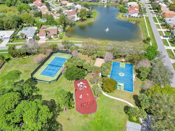an aerial view of residential houses with outdoor space
