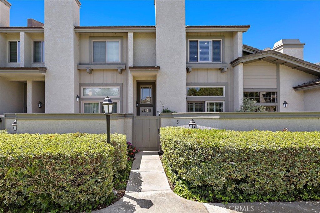 5 Morningside Irvine, CA 92603 - Photo 1 of 58 a front view of a house with a yard