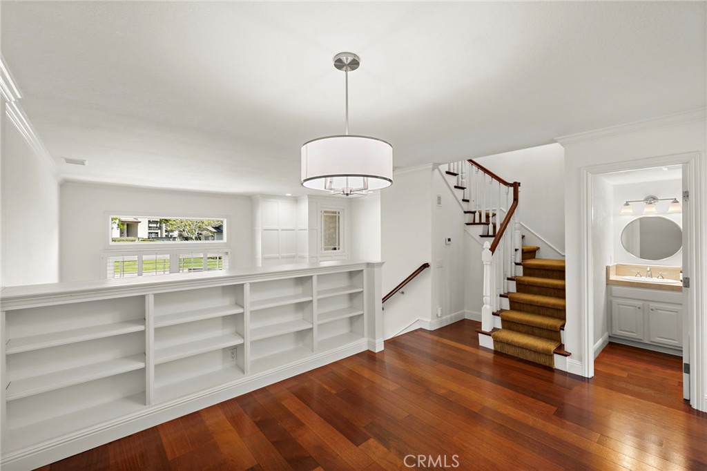 5 Morningside Irvine, CA 92603 - Photo 13 of 58 a view of hallway with stairs and wooden floor