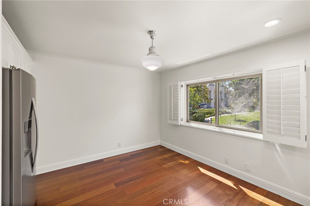 5 Morningside Irvine, CA 92603 - Photo 20 of 58 a view of empty room with wooden floor and fan