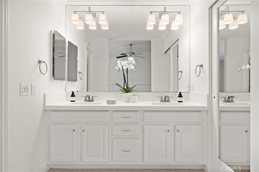 5 Morningside Irvine, CA 92603 - Photo 22 of 58 a bathroom with double sink and a mirror