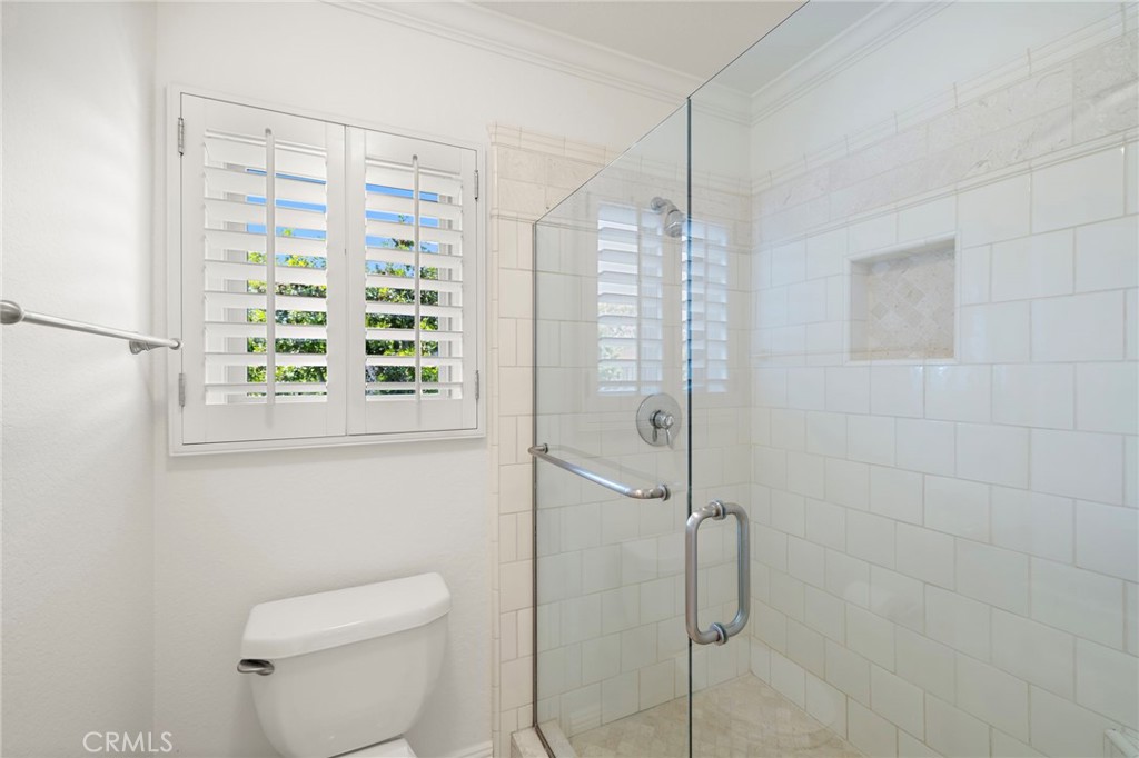 5 Morningside Irvine, CA 92603 - Photo 24 of 58 a bathroom with a shower and toilet