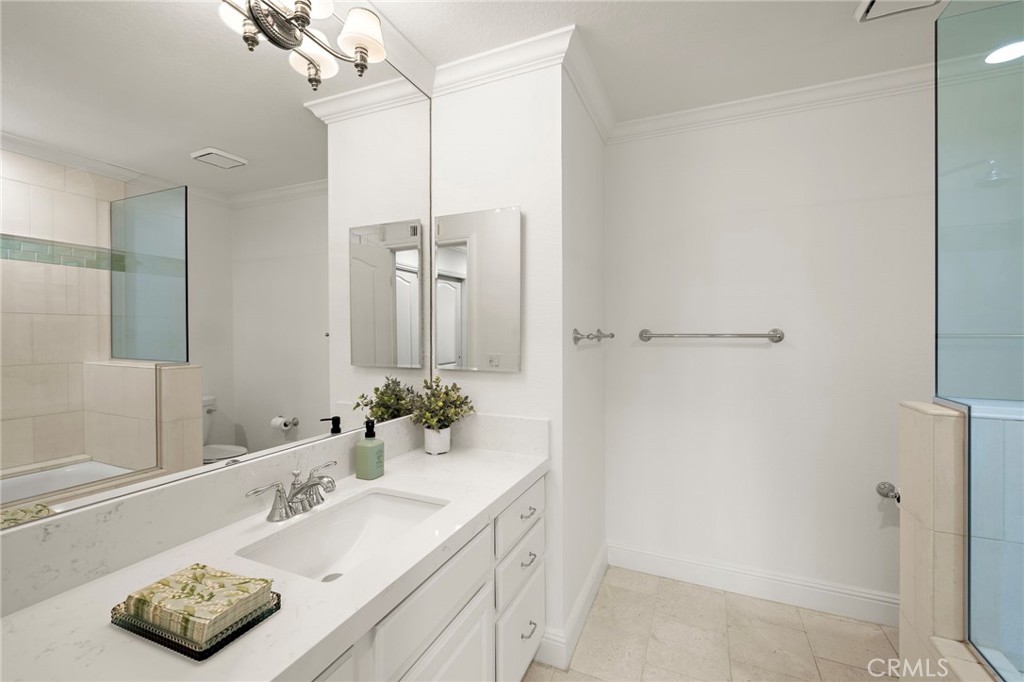5 Morningside Irvine, CA 92603 - Photo 31 of 58 a bathroom with a sink and a mirror