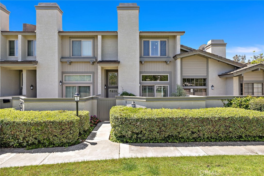 5 Morningside Irvine, CA 92603 - Photo 38 of 58 a front view of a house with a yard