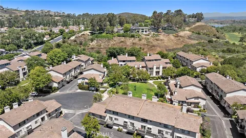 aerial view of a house with a yard