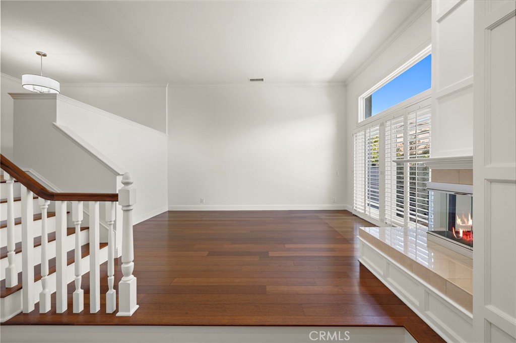 5 Morningside Irvine, CA 92603 - Photo 7 of 58 a view of an entryway with wooden floor