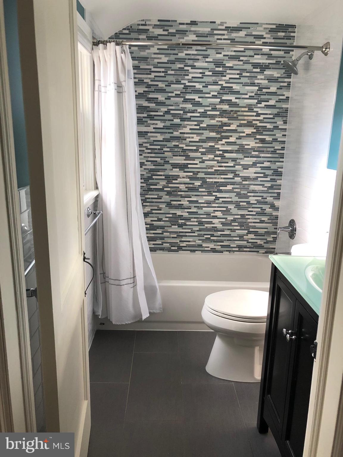 226 Crosshill Road Wynnewood, PA 19096 - Photo 15 of 26 a bathroom with a toilet and a shower