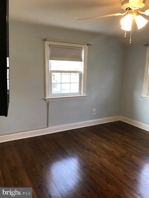 226 Crosshill Road Wynnewood, PA 19096 - Photo 16 of 26 an empty room with wooden floor and windows