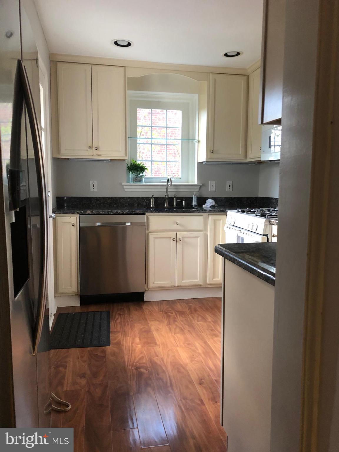 226 Crosshill Road Wynnewood, PA 19096 - Photo 5 of 26 a kitchen with stainless steel appliances granite countertop a stove a sink and a refrigerator