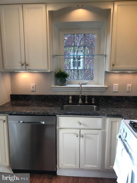 226 Crosshill Road Wynnewood, PA 19096 - Photo 7 of 26 a kitchen with white cabinets and sink