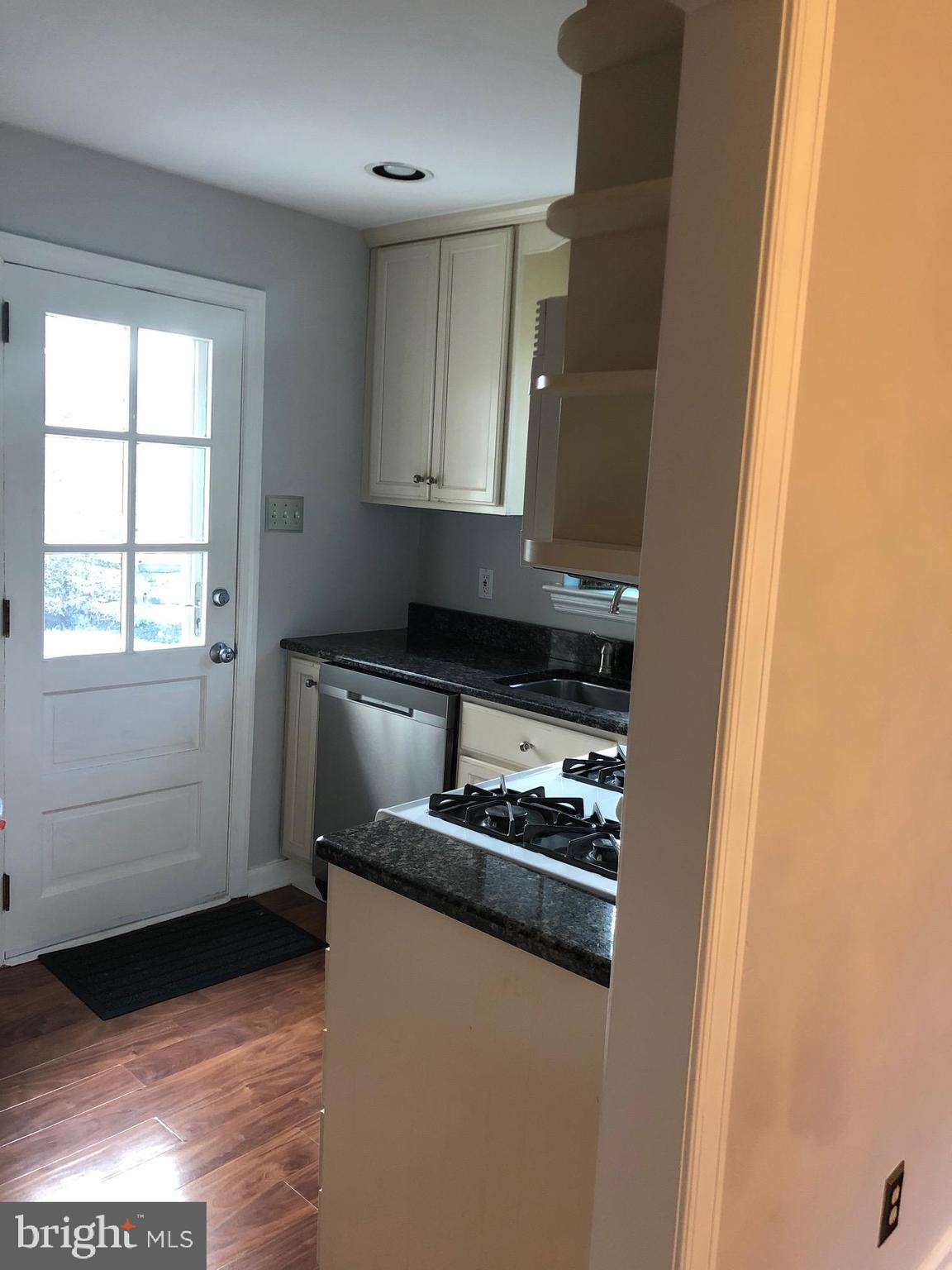 226 Crosshill Road Wynnewood, PA 19096 - Photo 8 of 26 a kitchen with stainless steel appliances granite countertop a stove and a refrigerator