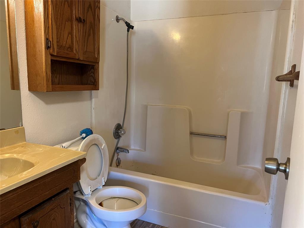 3711 Greenwood Road Weatherford, TX 76088 - Photo 11 of 15 a bathroom with a sink a toilet and shower
